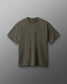 Green t-shirt with a small logo on a gray background