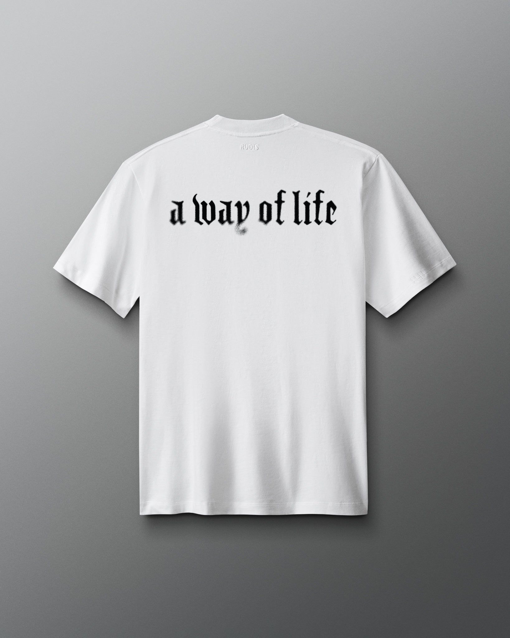 White t-shirt with 'a way of life' text on a gray background
