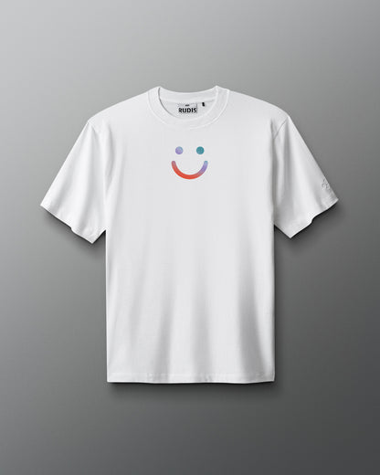 White t-shirt with a colorful smiley face design on a gray background. Sarah Hildebrandt