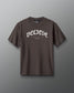 Brown t-shirt with 'BELIEVE' text on a gray background