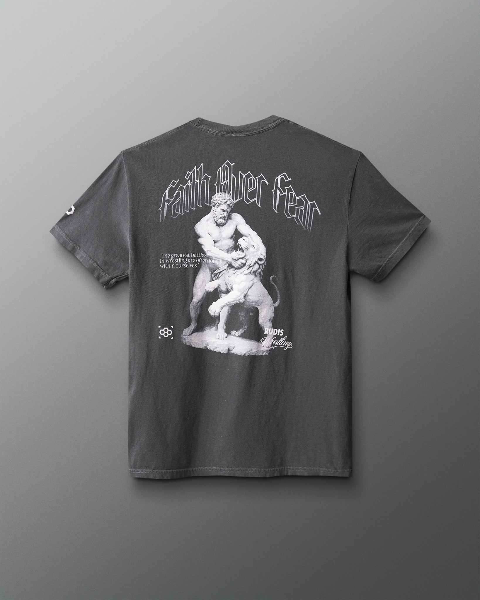 Gray t-shirt with a graphic design on the back against a gray background