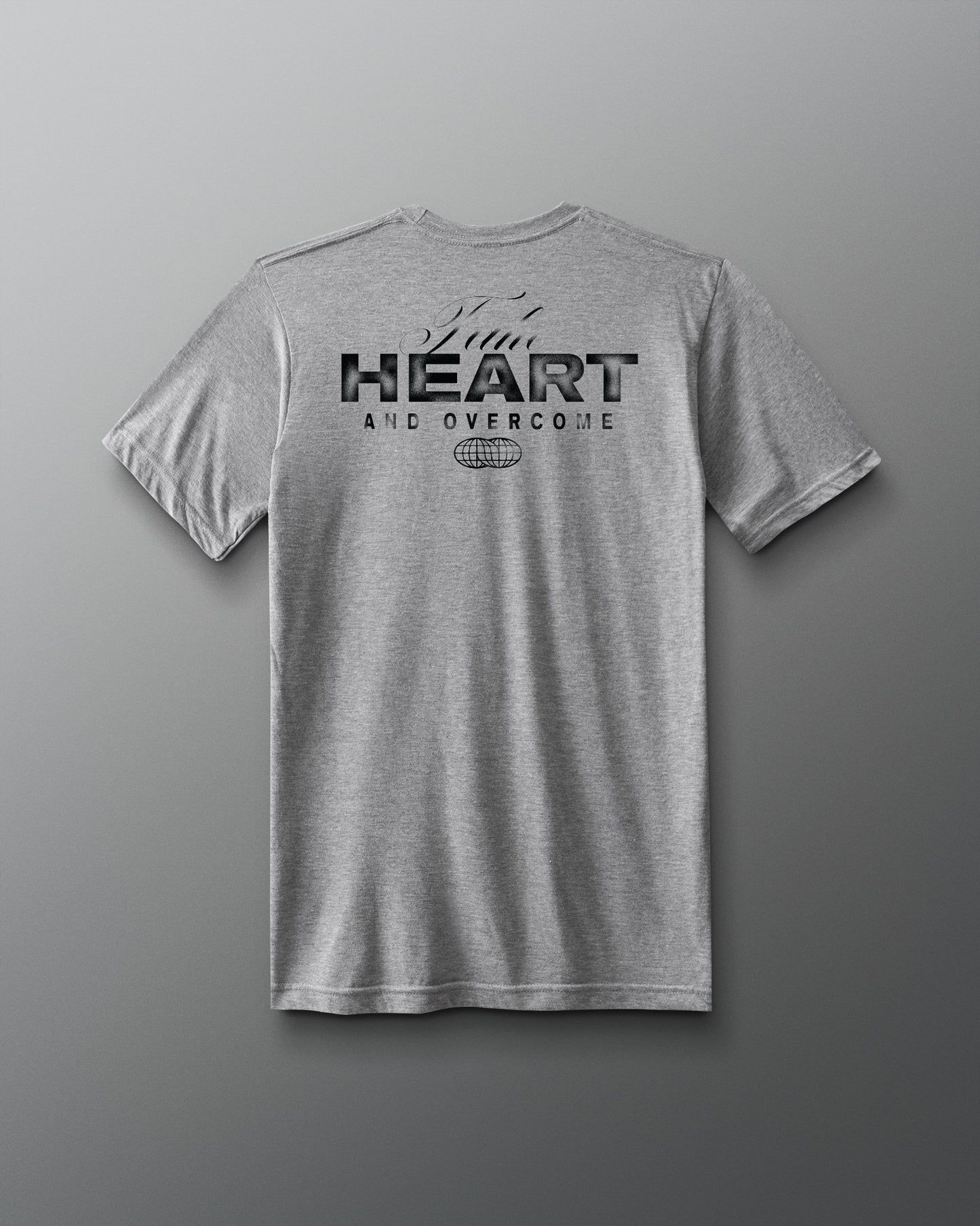 Grey t-shirt HEART and Overcome RUDIS black text on back of shirt