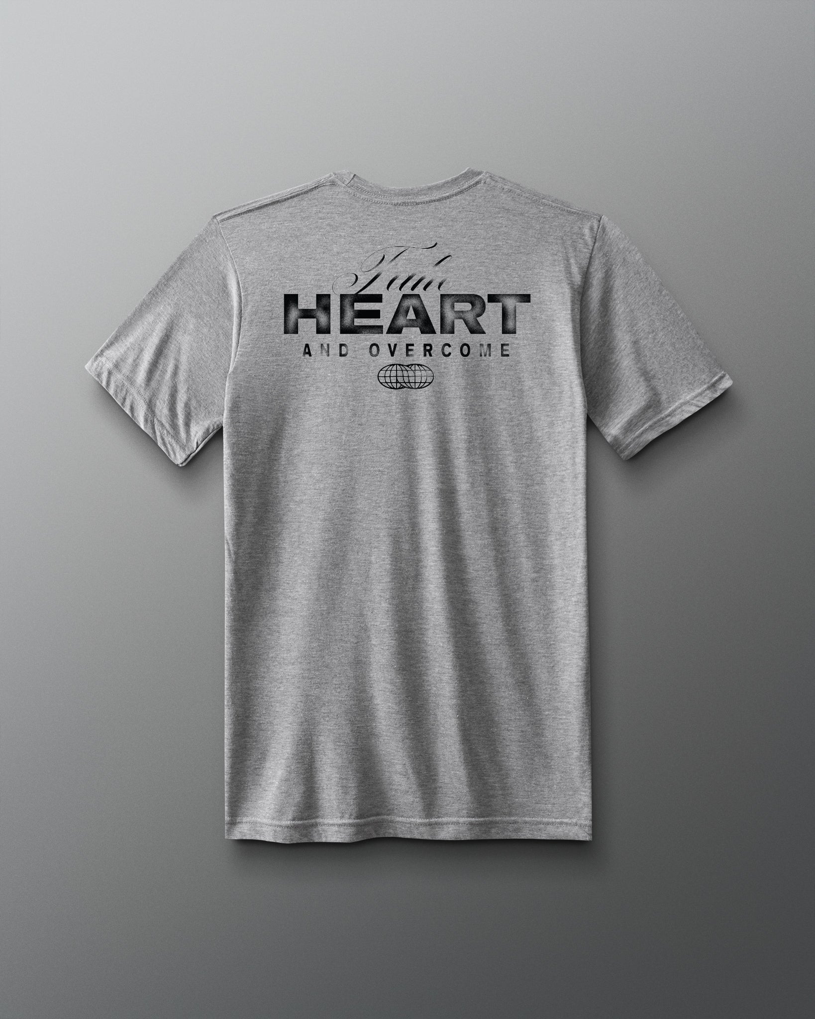 Grey t-shirt HEART and Overcome RUDIS black text on back of shirt