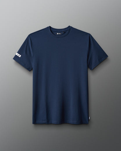 Navy blue t-shirt on a gray background