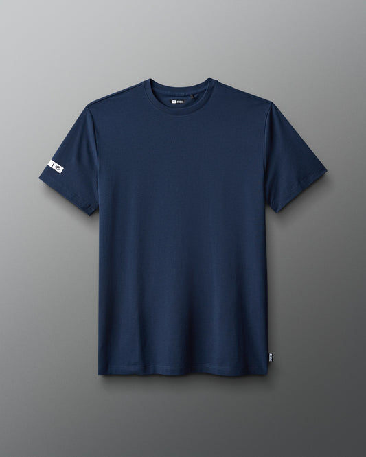 Navy blue t-shirt on a gray background