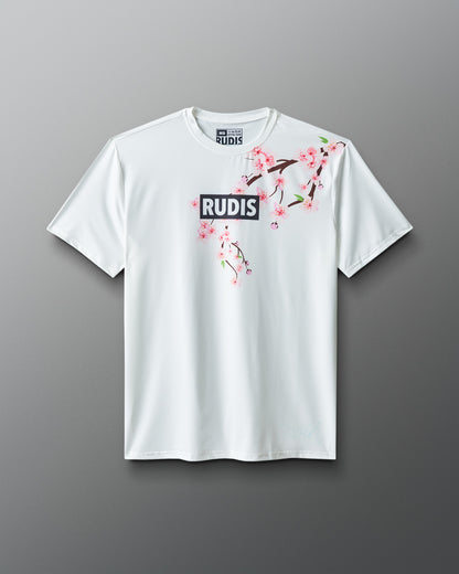 White t-shirt with floral design and 'RUDIS' branding on a gray background
