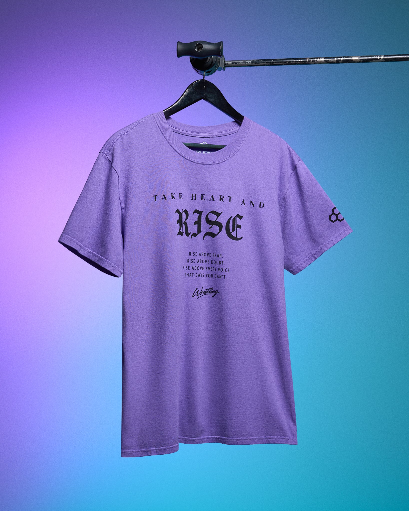 Purple t-shirt with text on a hanger against a gradient background