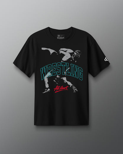 Black t-shirt with wrestling graphic and text on a gray background