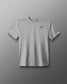 Gray t-shirt with a small logo on a gray background