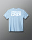 Light blue t-shirt with 'Wrestling Coach' text on a gray background