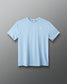 Light blue t-shirt with a small logo on a gray background