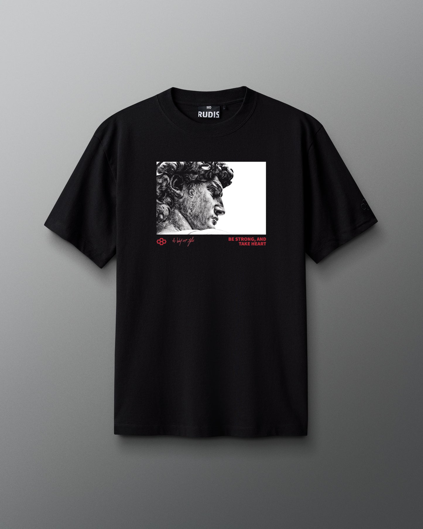 Black t-shirt with a graphic design on a gray background