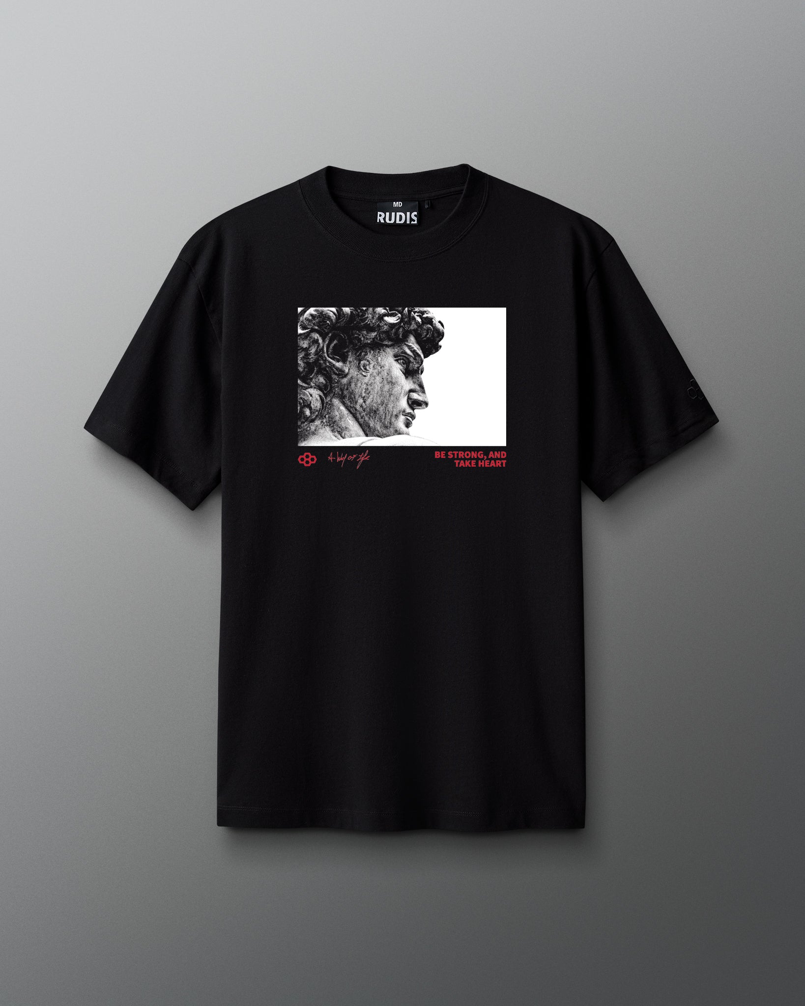 Black t-shirt with a graphic design on a gray background