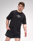 Man wearing a black t-shirt with 'IRON SHARPENS IRON' text and black shorts on a white background