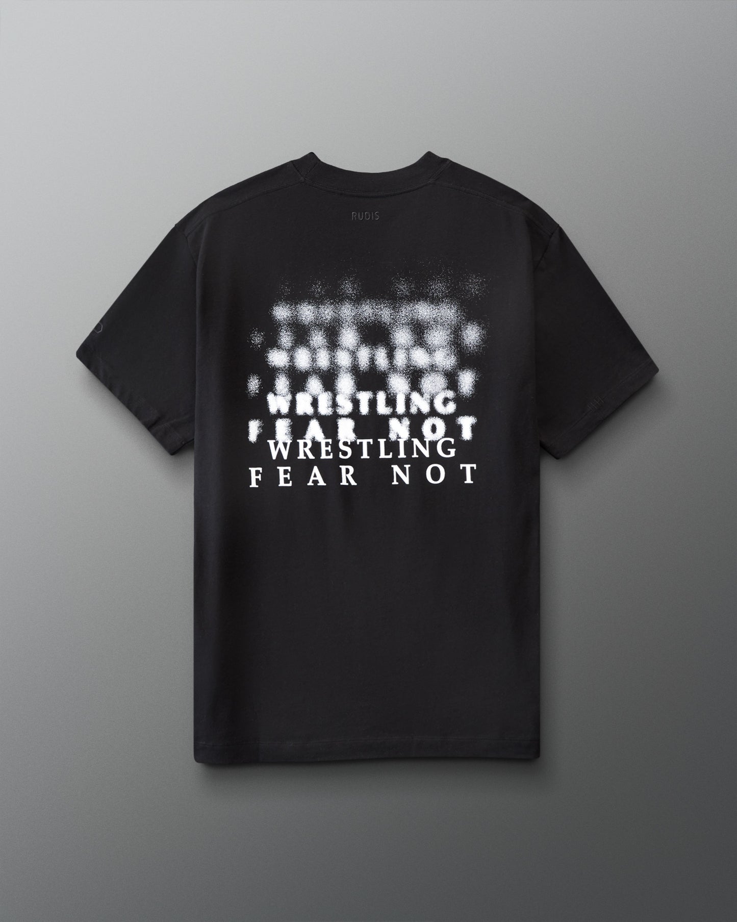 Black t-shirt with white 'Wrestling Fear not' text on a gray background