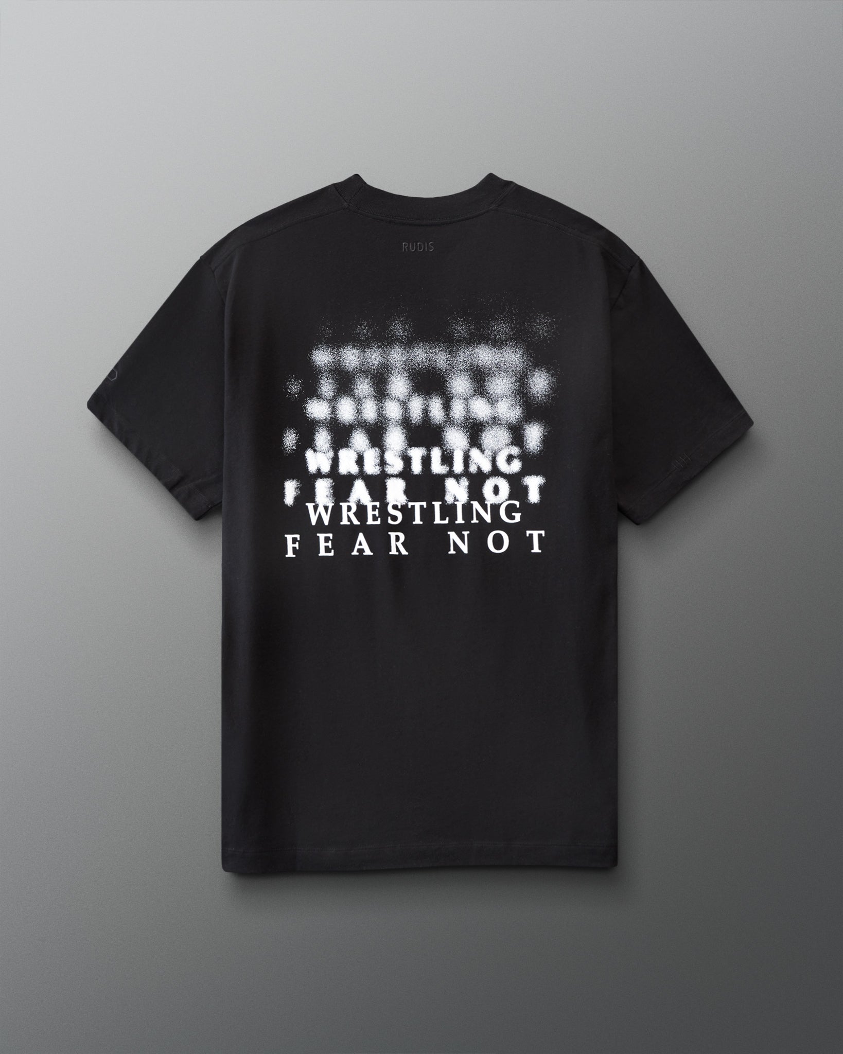 Black t-shirt with white 'Wrestling Fear not' text on a gray background