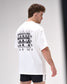 Man wearing a white t-shirt with 'Wrestling Fear not' text on the back, standing against a plain background