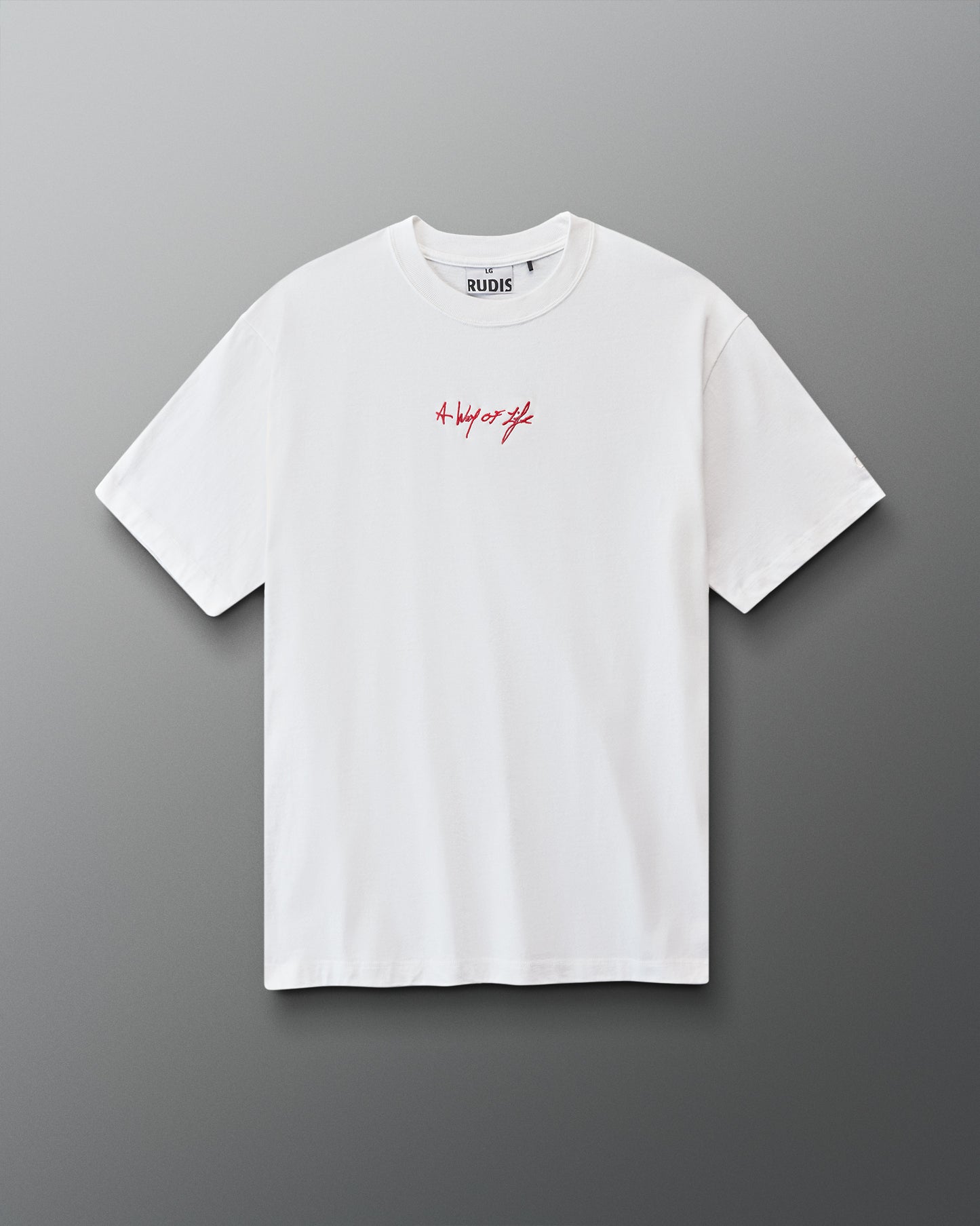 White t-shirt with red 'A way of life' text on a gray background