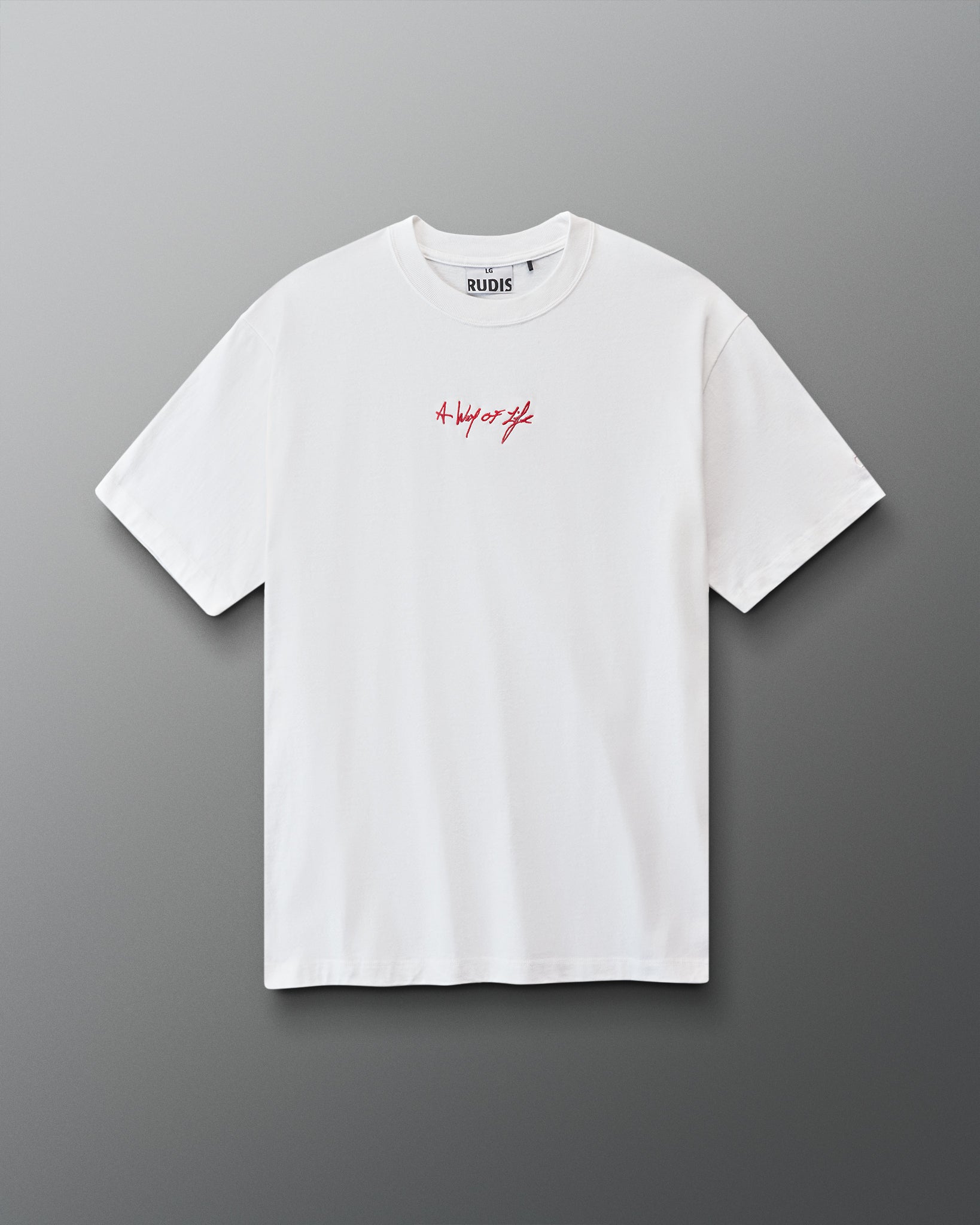 White t-shirt with red 'A way of life' text on a gray background