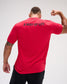 A man viewed from behind wearing a bright red athletic t-shirt with the text 'A WAY OF LIFE' printed in dark blue across the upper back, paired with black pants, against a light gray studio background.