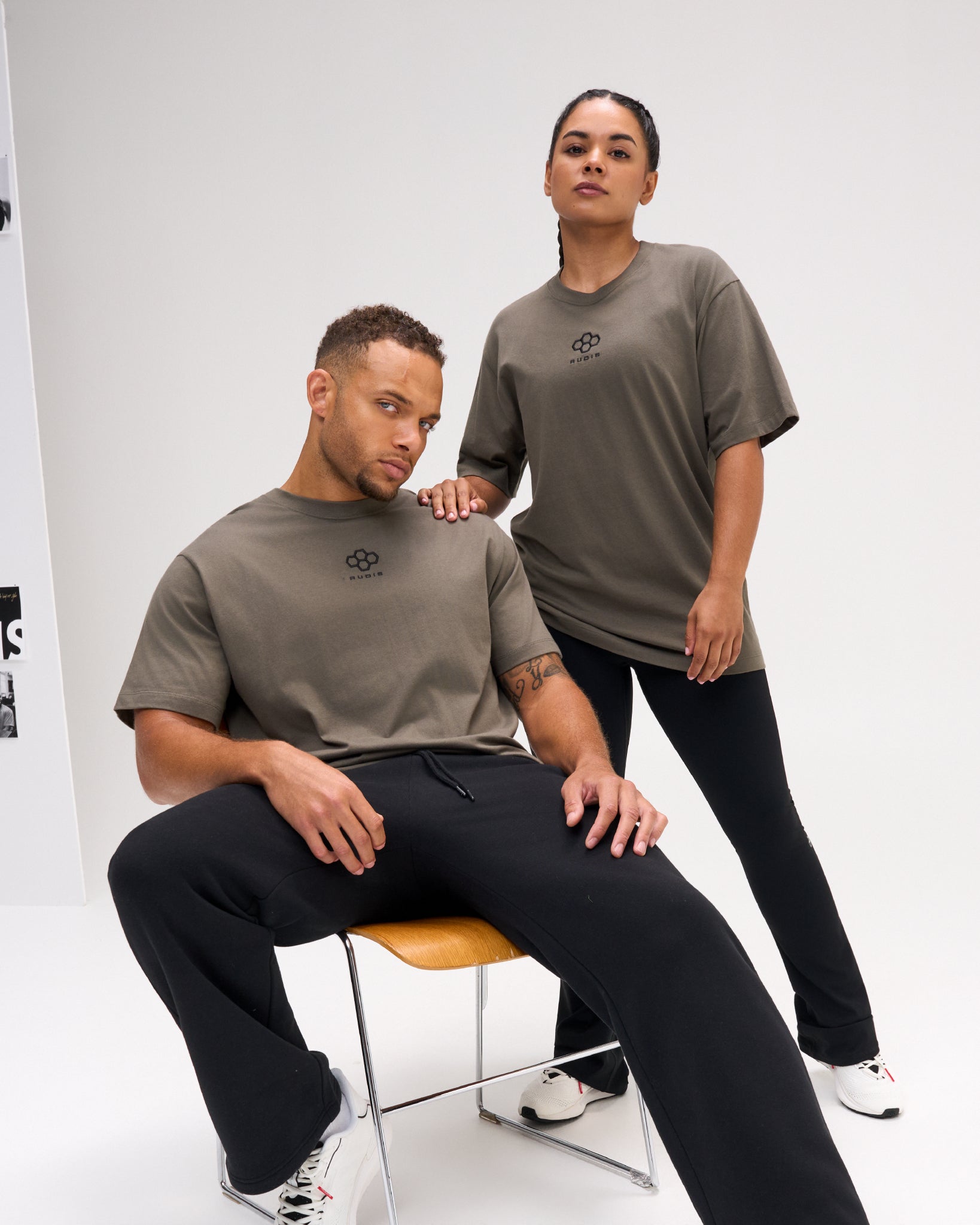 Two models wearing the RUDIS Hex Classic Cotton T-Shirt in Army, featuring a black embroidered Hex logo, crew neckline and relaxed short-sleeve fit.
