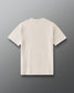 Back view of RUDIS Hex Classic Cotton T-Shirt in Bone with a plain back design and subtle tonal RUDIS branding below the collar.