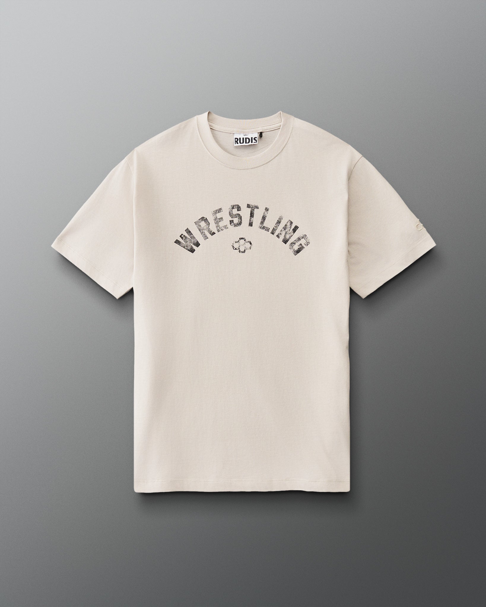 Front view of RUDIS Wrestling Classic Cotton T-Shirt in Bone featuring distressed arched WRESTLING lettering and the RUDIS Hex logo.
