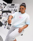Female model wearing the RUDIS Faith Over Fear Classic Cotton T-Shirt in Blue Tie Dye with a pink A Way of Life chest graphic and RUDIS Hex logo.