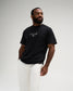 Male model wearing the RUDIS Faith Over Fear Classic Cotton T-Shirt in Washed Black, featuring a white A Way of Life chest graphic and RUDIS Hex logo.