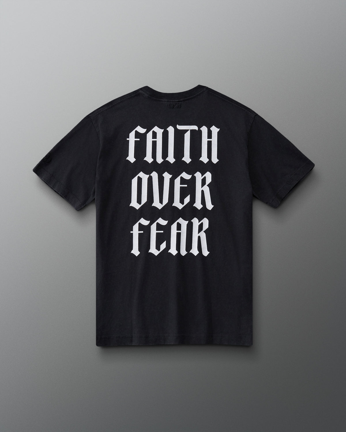 Back view of the RUDIS Faith Over Fear T-Shirt in Washed Black with oversized white gothic Faith Over Fear graphic.