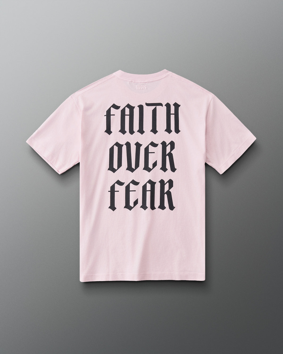 Back view of the RUDIS Faith Over Fear T-Shirt in Washed Pink featuring bold black gothic Faith Over Fear back lettering.