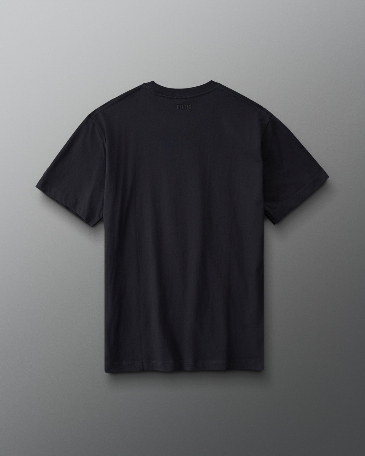 Back view of the RUDIS Divine Struggle Relaxed Cotton T-Shirt in Washed Black featuring a plain back with subtle RUDIS branding below the collar.