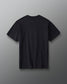 Back view of the RUDIS Divine Struggle Relaxed Cotton T-Shirt in Washed Black featuring a plain back with subtle RUDIS branding below the collar.