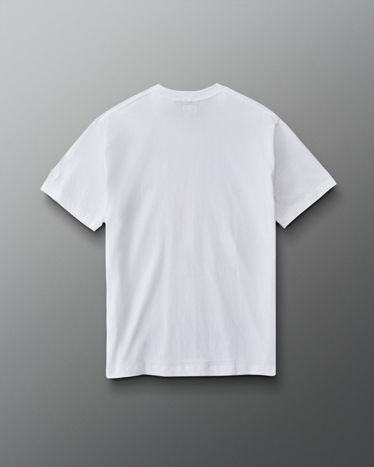 Back view of the RUDIS Divine Struggle Relaxed Cotton T-Shirt in White with a clean, minimal design and subtle RUDIS branding below the collar.