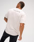 Back view of male model wearing the bone RUDIS Relaxed Cotton T-Shirt with A WAY OF LIFE lettering printed across the upper back.