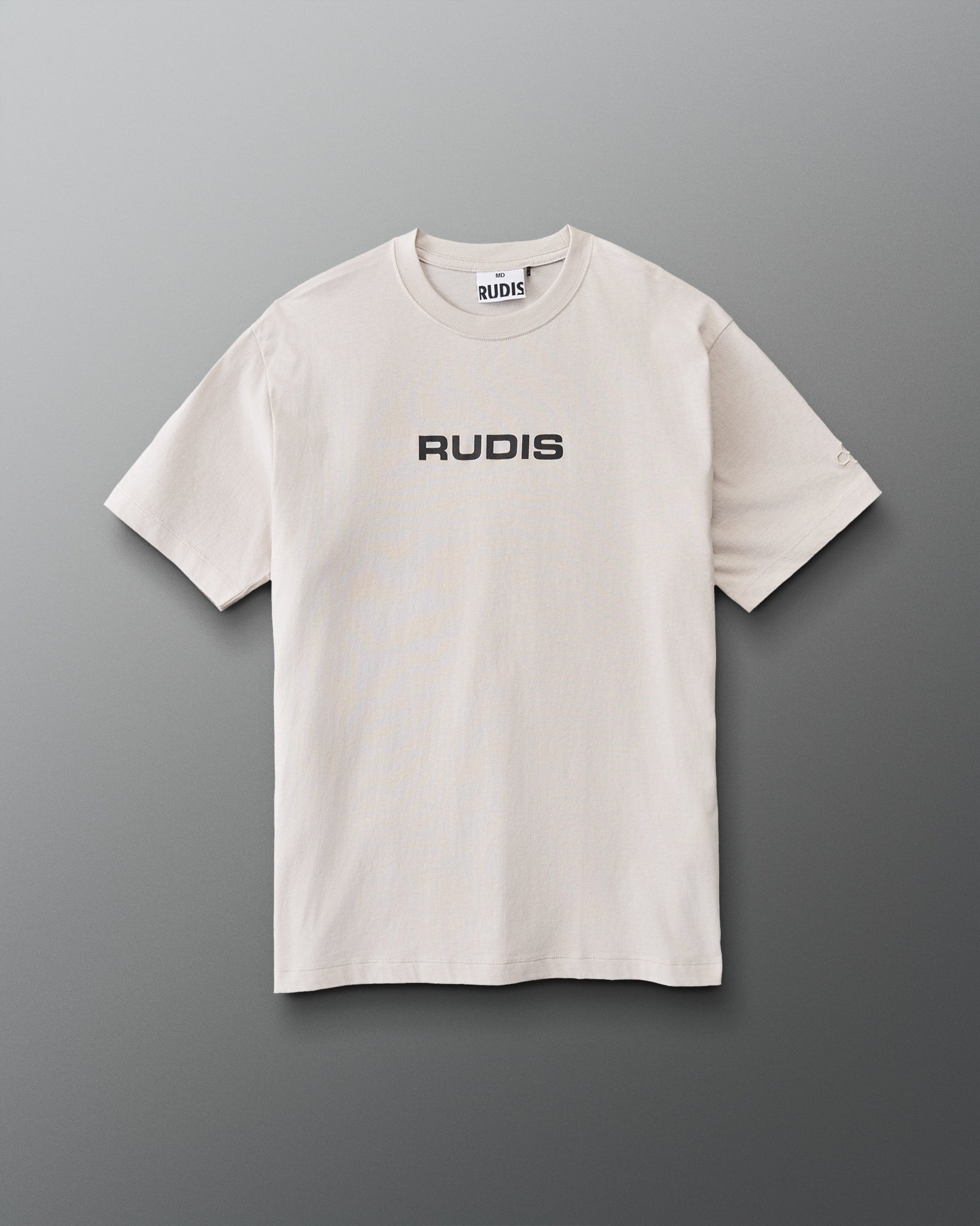 Front view of RUDIS Relaxed Cotton T-Shirt in Bone featuring black RUDIS chest logo, short sleeves, relaxed silhouette, and crew neckline.