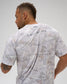 Back view of male model wearing the RUDIS Relaxed Cotton T-Shirt in tree camo with A WAY OF LIFE lettering across the upper back.