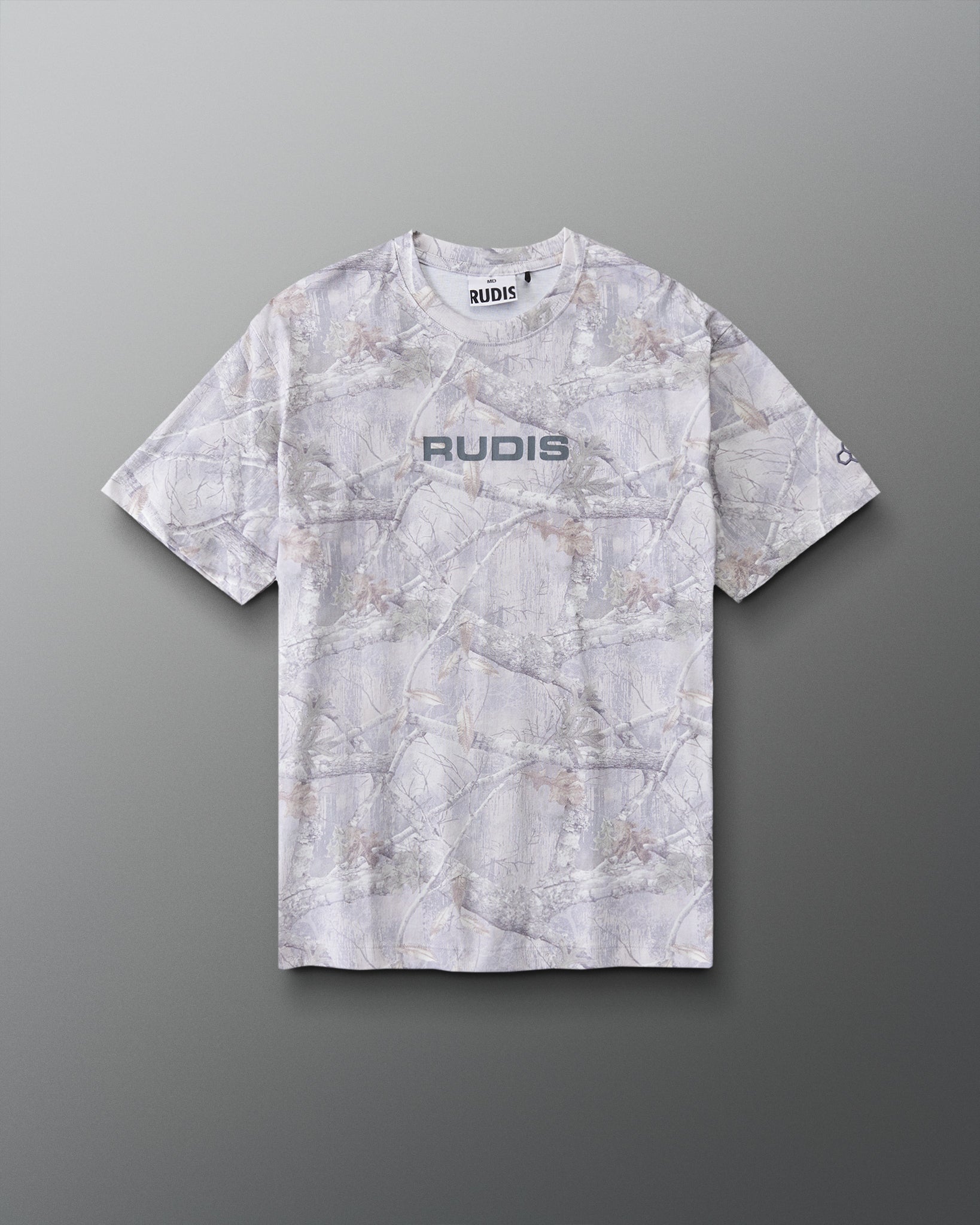 Front view of RUDIS Relaxed Cotton T-Shirt in Tree Camo featuring an allover woodland camouflage print, gray RUDIS chest logo, and crew neckline.