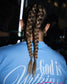 Back view of a person with long light brown hair styled in two braided ponytails, wearing a light blue t-shirt with 'God is Within' printed on the back.