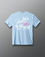 Light blue t-shirt with motivational quote on a gray background