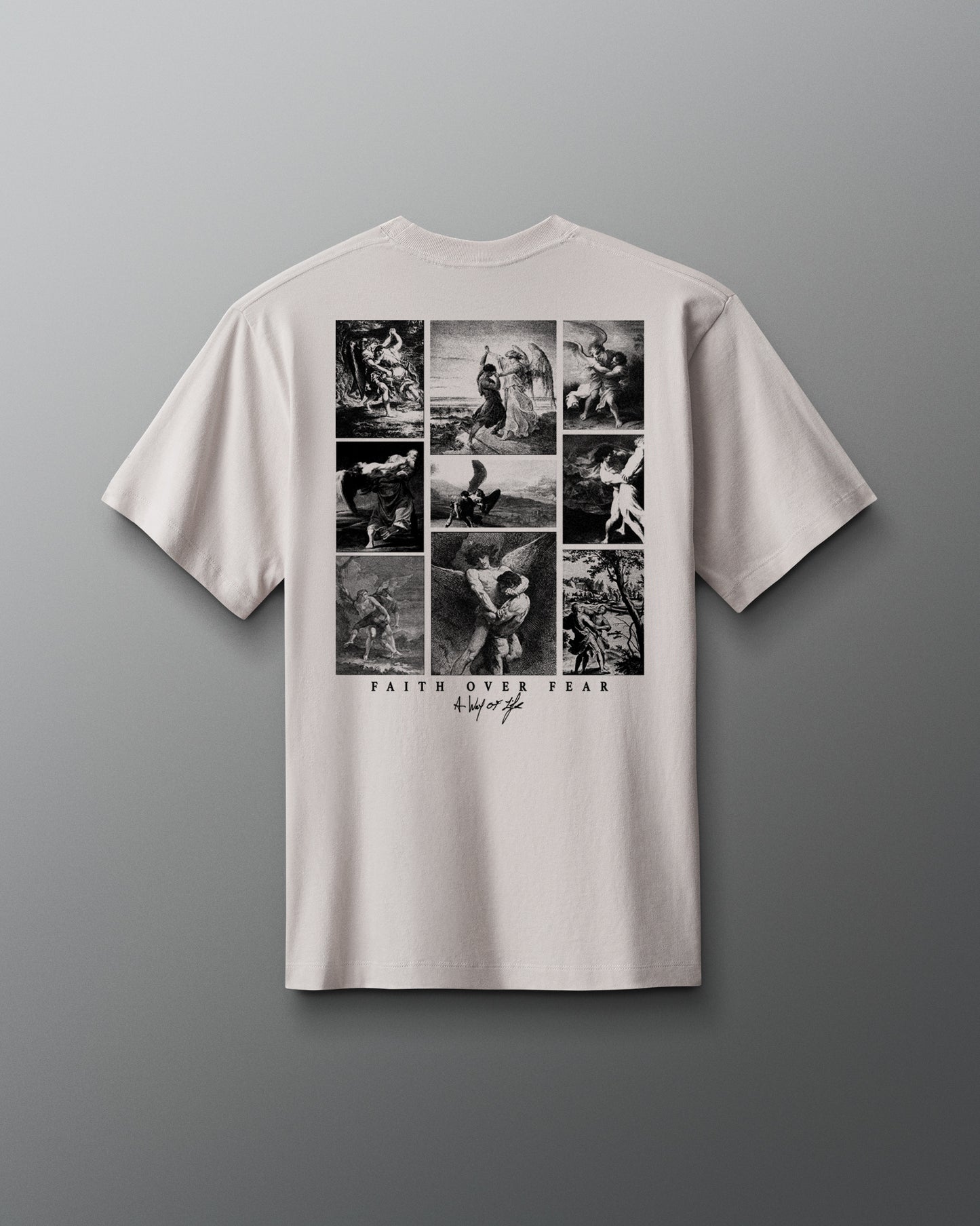 White t-shirt with black graphic design on a gray background