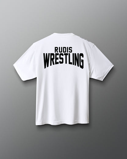 A white short-sleeve t-shirt shown from the back, featuring the words 'RUDIS WRESTLING' printed in bold black letters across the upper back, set against a dark gray gradient background.