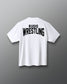 A white short-sleeve t-shirt shown from the back, featuring the words 'RUDIS WRESTLING' printed in bold black letters across the upper back, set against a dark gray gradient background.