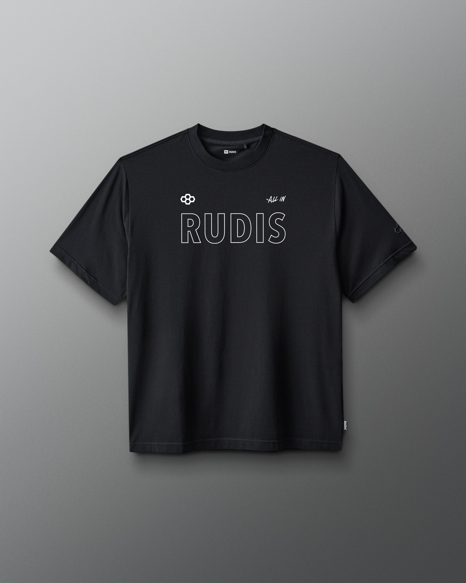 A black short-sleeve crewneck t-shirt with 'RUDIS' printed in white outline text across the chest, displayed against a dark gray gradient background.