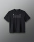 A black short-sleeve crewneck t-shirt with 'RUDIS' printed in white outline text across the chest, displayed against a dark gray gradient background.
