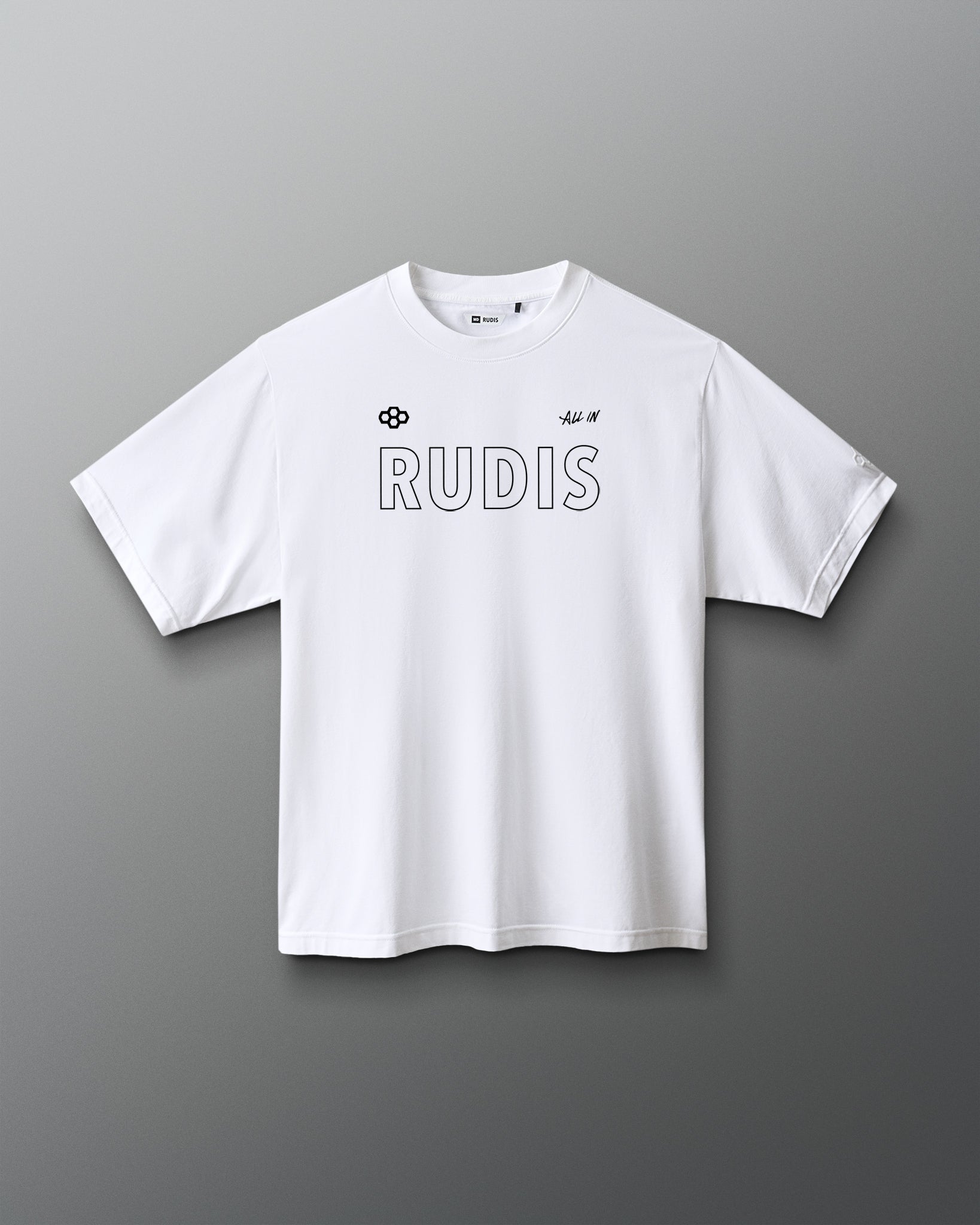 A white short-sleeve crewneck t-shirt with 'RUDIS' printed across the chest in a thin black outline font, accompanied by small black logos on the left chest, shown against a dark gray gradient background.