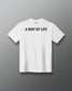 White t-shirt with 'A Way of Life' text on the back against a gray background