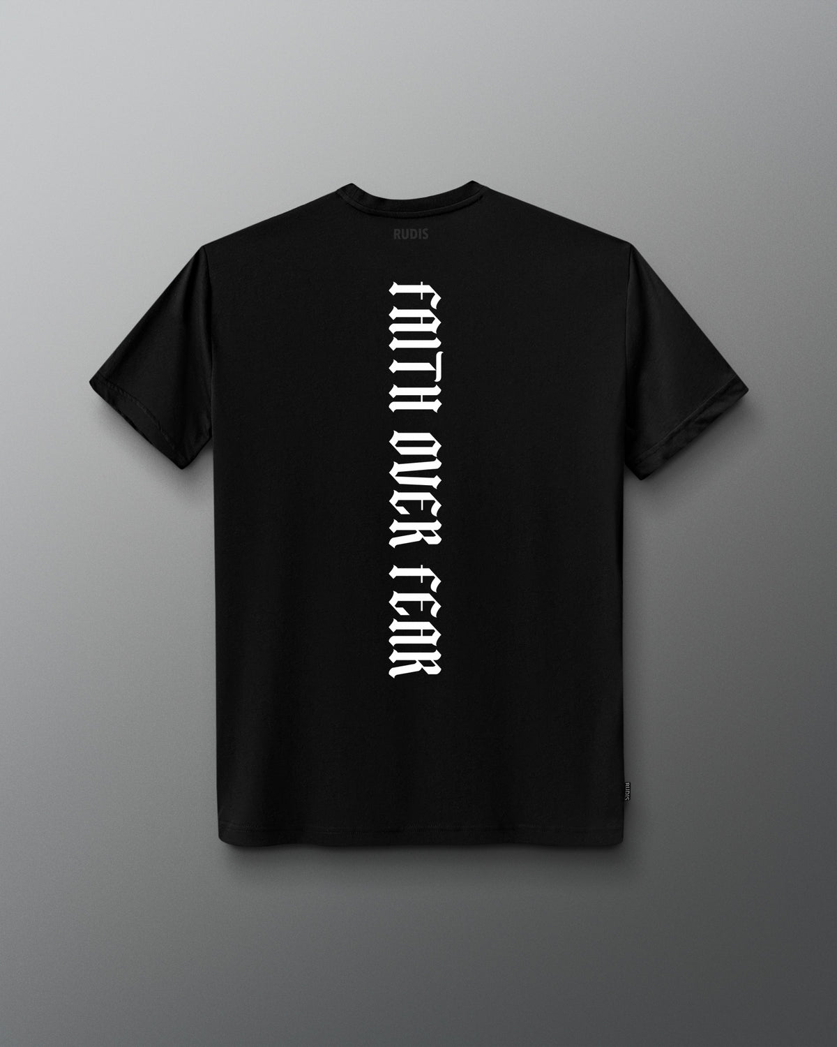 Back of the black RUDIS Cross Elite Super Soft T-Shirt featuring vertical white “Faith Over Fear” lettering and tonal RUDIS neck branding.