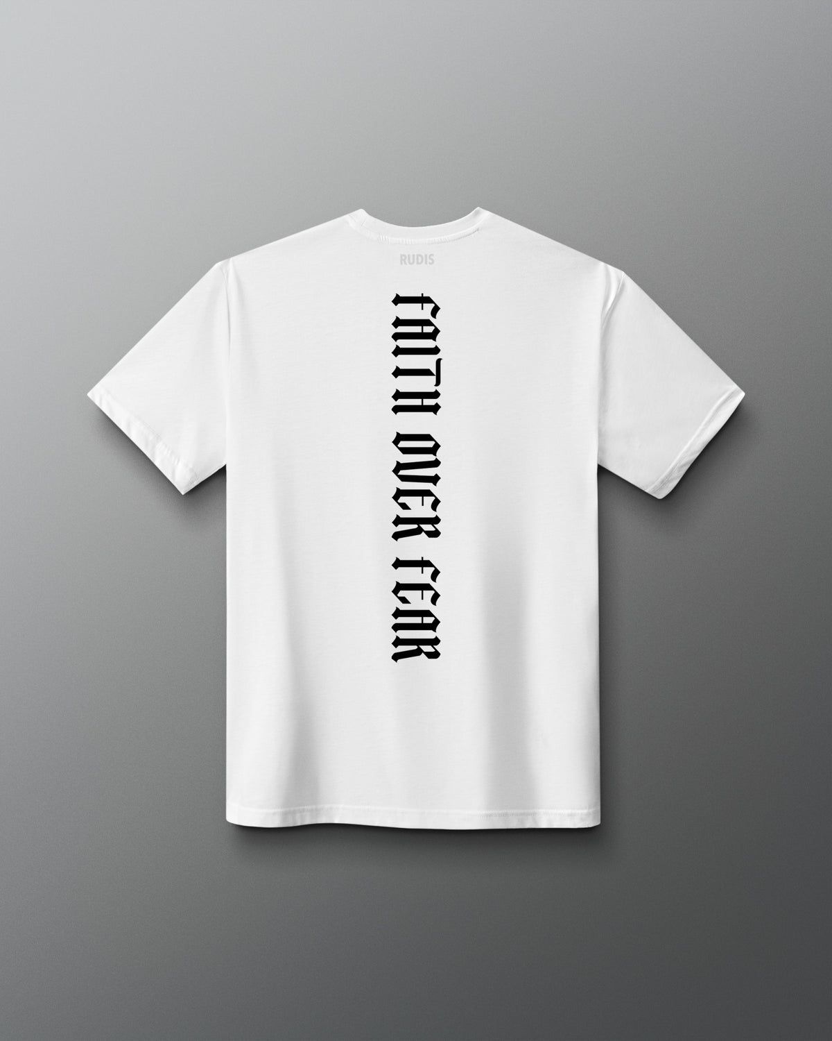 Back of the white RUDIS Cross Elite Super Soft T-Shirt featuring vertical black “Faith Over Fear” lettering and RUDIS neck branding.