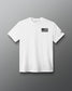 White RUDIS Core Flag Elite Super Soft T-Shirt shown from the front, featuring a black American flag graphic on the chest and contrasting RUDIS mark on the sleeve.